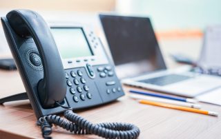 VoIP hosted business phone on a desk