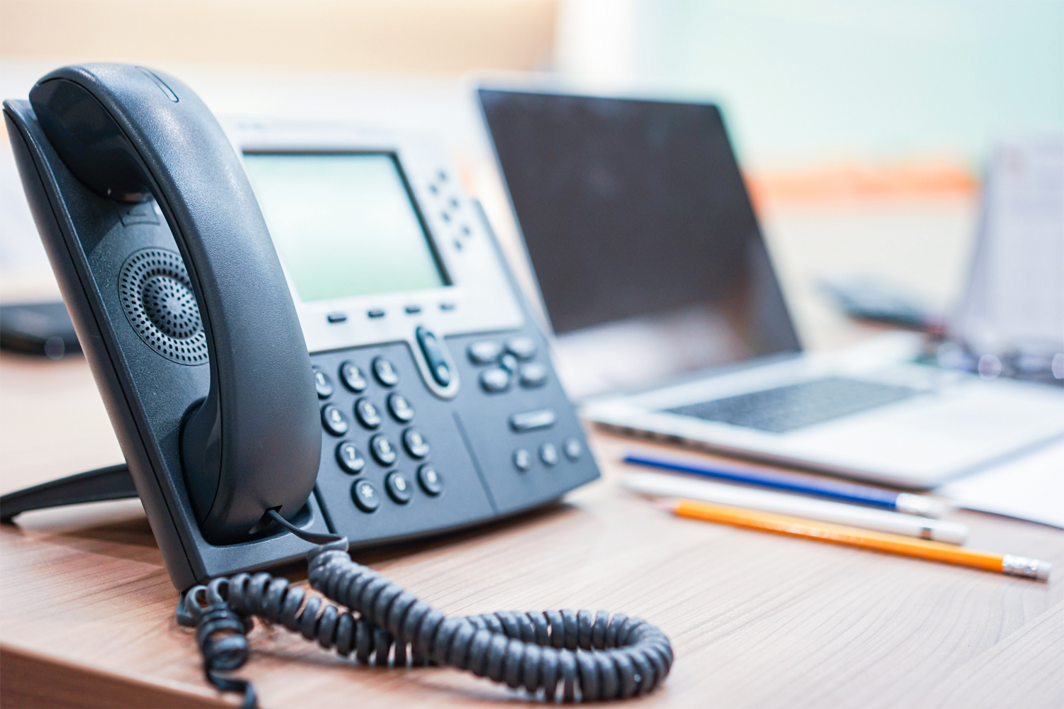 VoIP hosted business phone on a desk